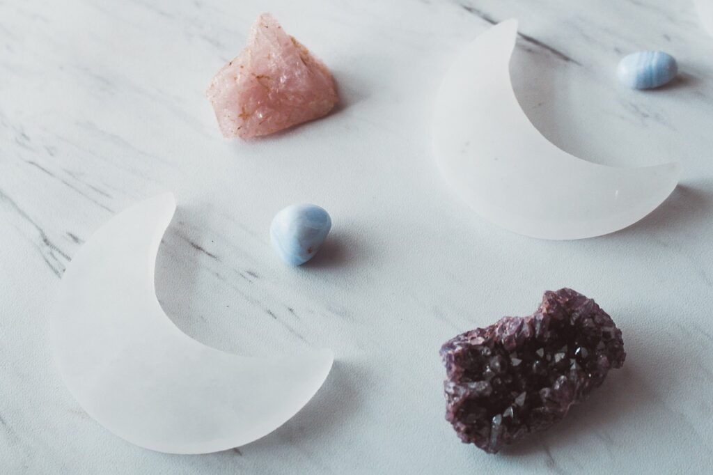 two selenite crystal moons